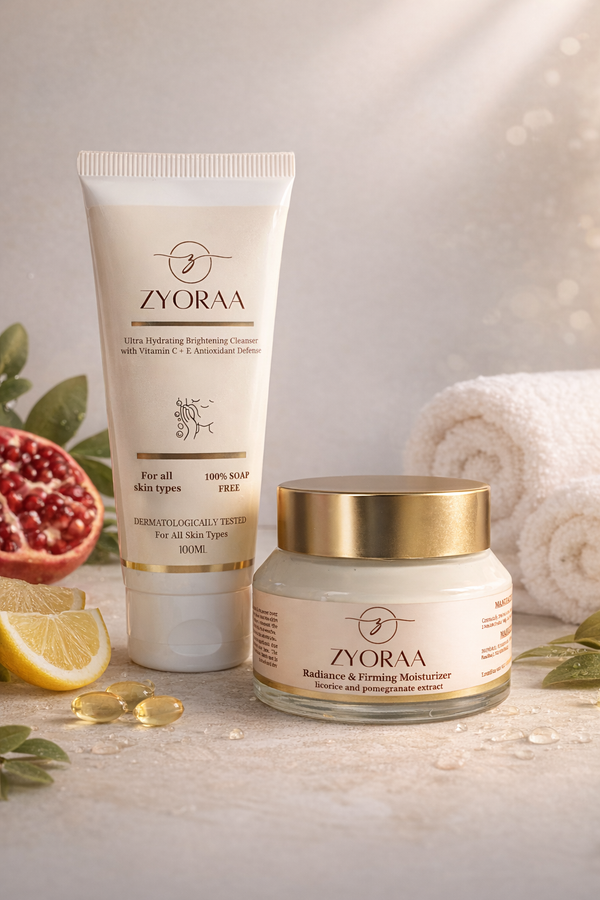 Zyora skincare products on a light background with pomegranate, lemon, and towel.